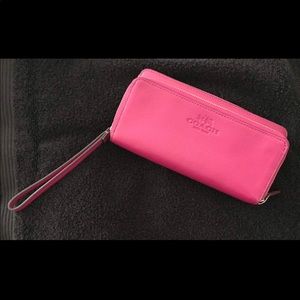 Raspberry colored coach wristlet